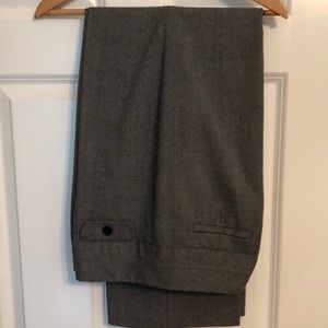 Gray dress slacks, sz 12. 1 back pocket has button missing. 3- button closure.